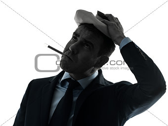 man sick with thermometer and ice pack silhouette portrait