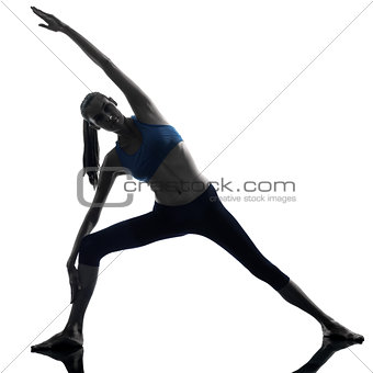 woman exercising stretching triangle pose yoga silhouette