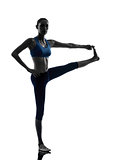 woman exercising yoga Hasta Padangusthasana silhouette
