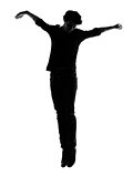 young man silhouette jumping happy