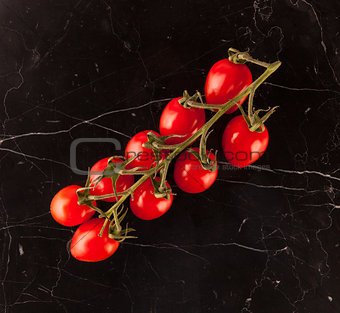 Vine tomatoes on marble table