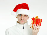 man in a Santa hat with Christmas gift