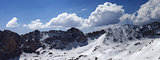 Panorama of snow mountains in sunny day