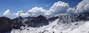 Panorama of snow mountains in sunny day