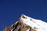 Mountain top with snow and cloudless blue sky in nice day