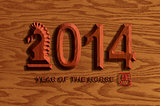 2014 Chinese Wood Chiseled Horse on Wood Grain Background