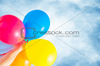 multicolored balloons against the sky