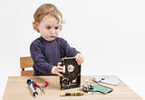child repairing hard disk drive