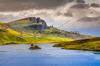 Landscape view of Old Man of Storr rock formation and lake, Scot