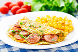 Omelet with sausage, tomato and herbs