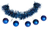 Five blue christmas balls as a bead on the tinsel