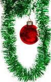 Christmas ball on a green tinsel as a symbol of the New year