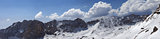Panorama of snowy mountains in nice sunny day