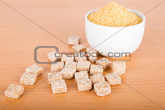 Brown cane sugar cubes and crystal sugar