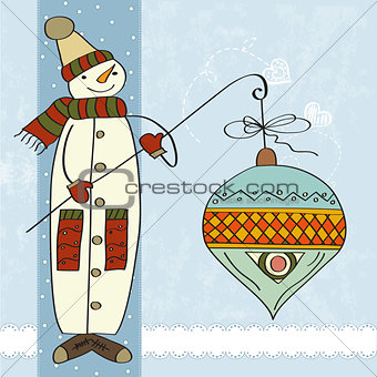 snowman with big Christmas ball