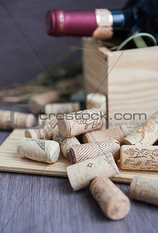 Wine corks on the table with bottle on the background