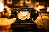 Detail view of old vintage dial telephone on the table 