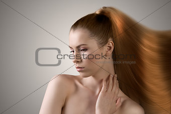 sensual woman with hair melting in paint