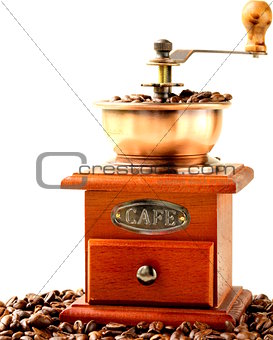 Vintage wooden coffee grinder full of roasted coffee beans