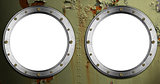 Two Metal Portholes on Green Background