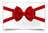 White gift card with red ribbon and bow