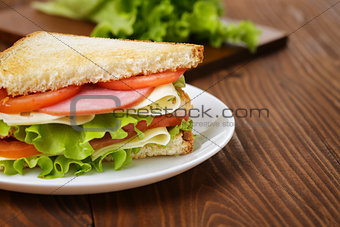 toasted sandwich with ham, cheese and vegetables
