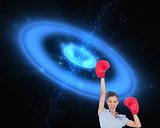 Businesswoman cheering wearing boxing gloves