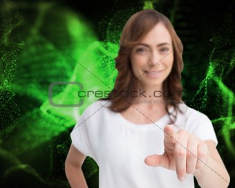Attractive businesswoman looking and pointing at camera