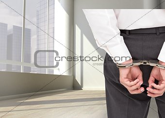 Close up on classy businessman wearing handcuffs