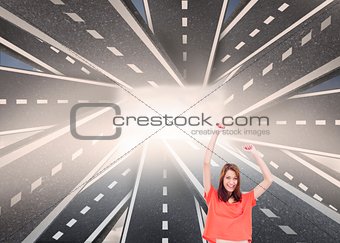 Cheerful woman with her arms raised up
