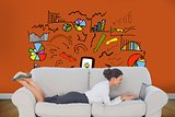 Businesswoman lying on couch using laptop