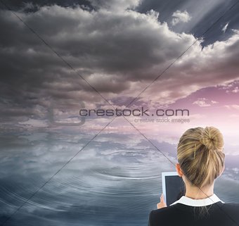 Blonde businesswoman holding new tablet