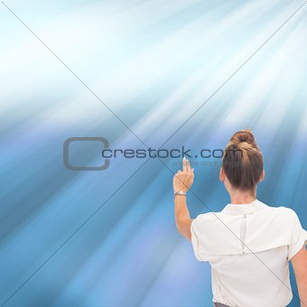 Businesswoman pointing at something with two fingers