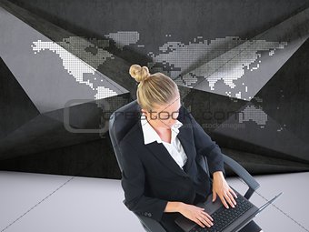 Businesswoman sitting on swivel chair with laptop