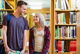 Couple looking at each other in the library