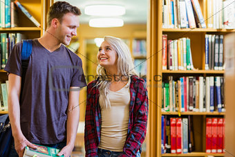 Couple looking at each other in the library