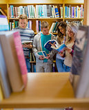 Students reading book in the college library