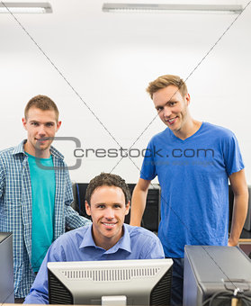 Teacher and young students in the computer room