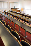 Empty seats with tables in a lecture hall