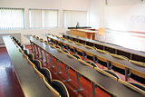 Empty seats with tables in a lecture hall
