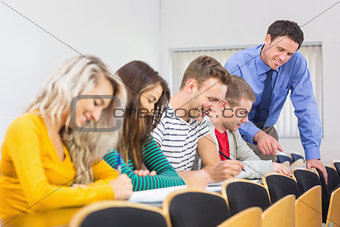 Teacher with college students at the classroom