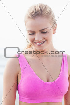 Close up of a smiling healthy woman looking down