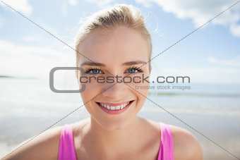 Close up of a smiling woman on beach