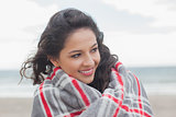 Close up of a woman covered with blanket at beach