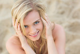 Overhead Close up portrait of smiling relaxed blond at beach