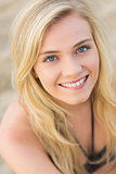 Overhead Close up portrait of smiling blond at beach