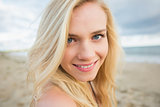 Close up portrait of smiling relaxed blond at beach