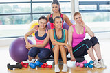 Group of fitness class at a bright exercise room