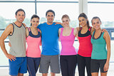 Portrait of a group of fitness class at exercise room