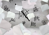 White paper in front of grey wall with tictactoe